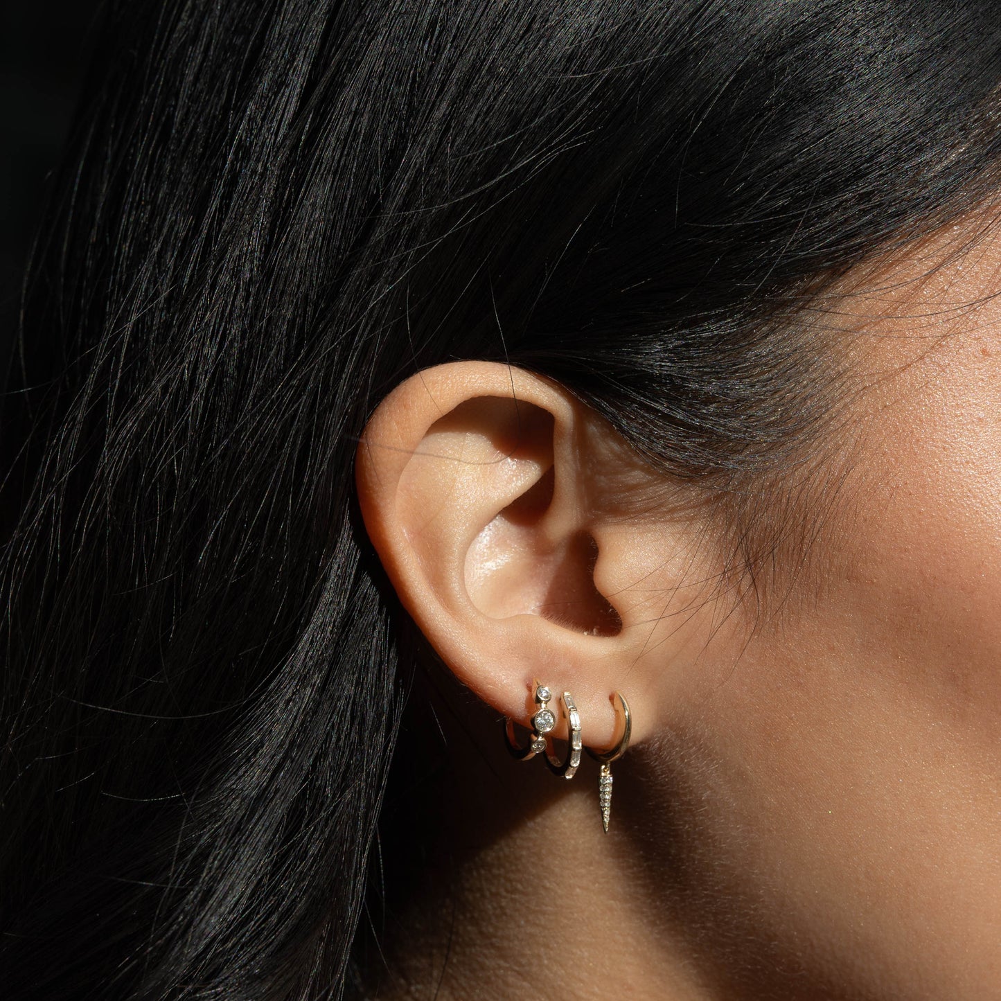 Dramatic diamond drop huggie hoop earrings in 14kt Yellow Gold