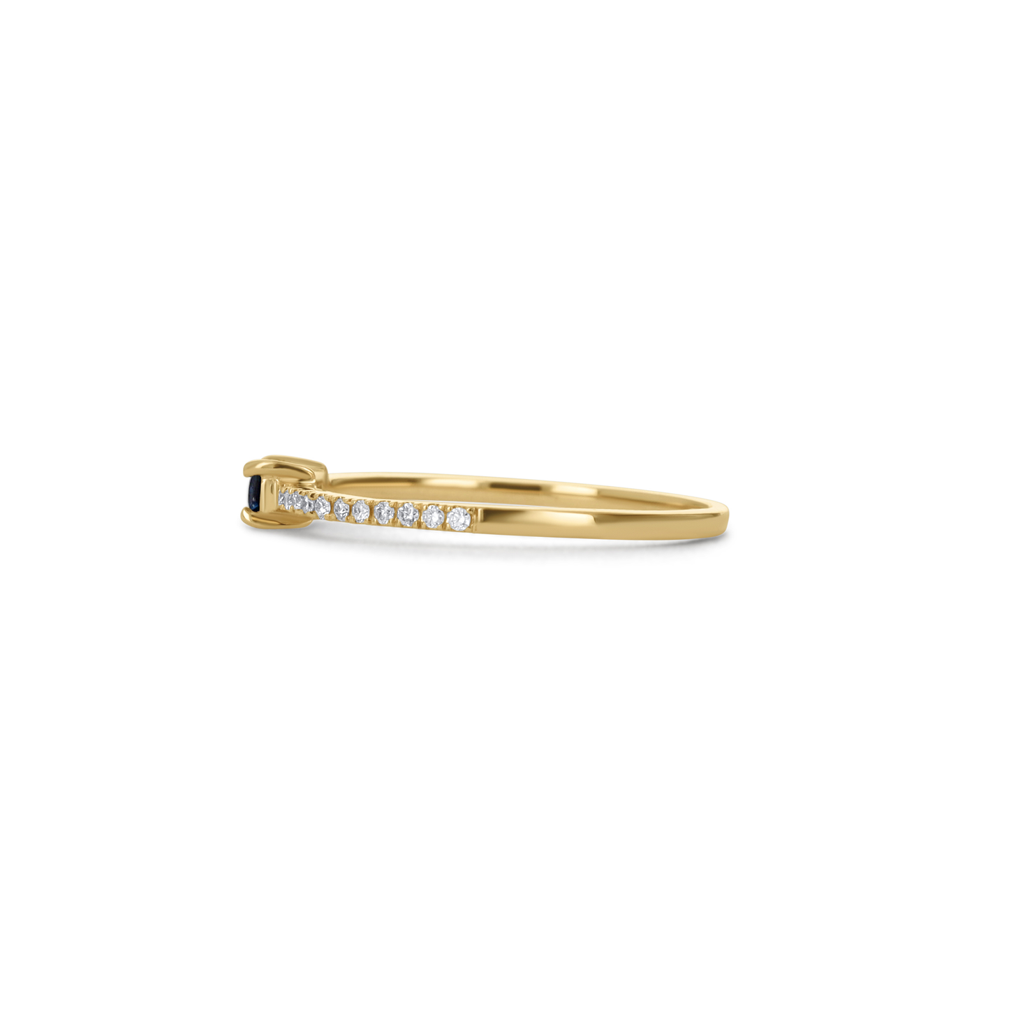Thin 14kt yellow gold ring with diamond details and a blue sapphire center.
