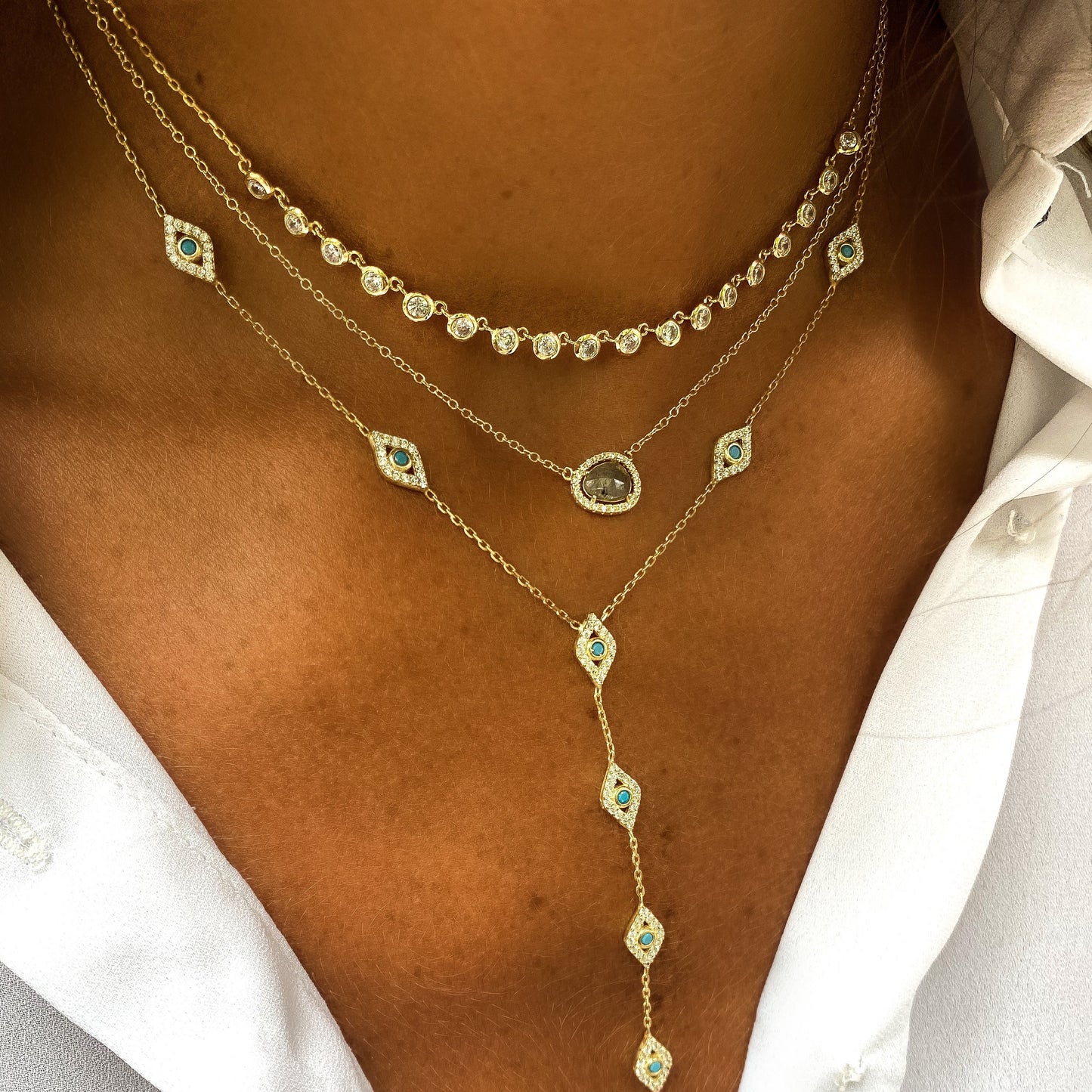Stacking our free form labradorite gemstone necklace in gold