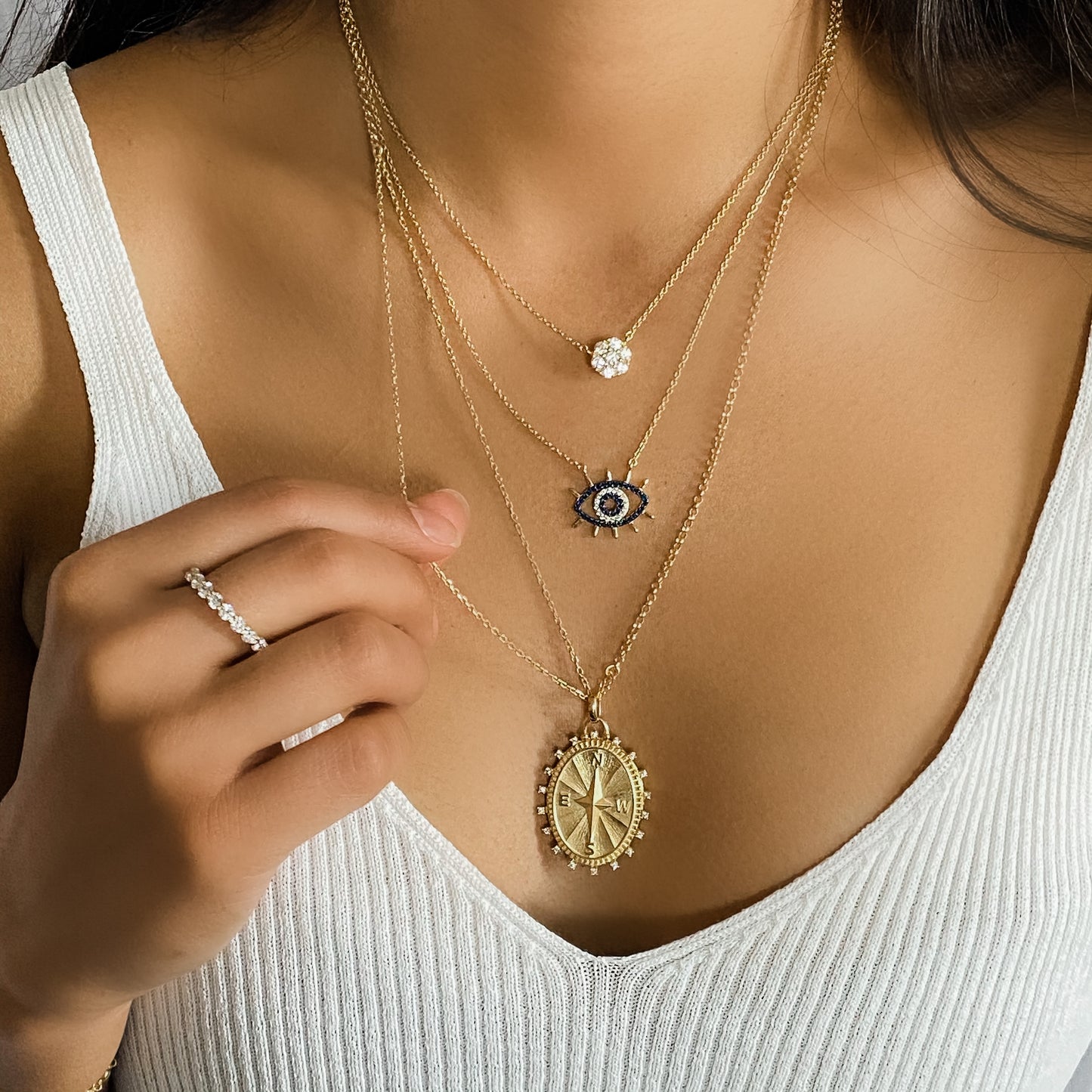 Wearing the gold wide eyed evil eye necklace from Alexandra Marks Jewelry