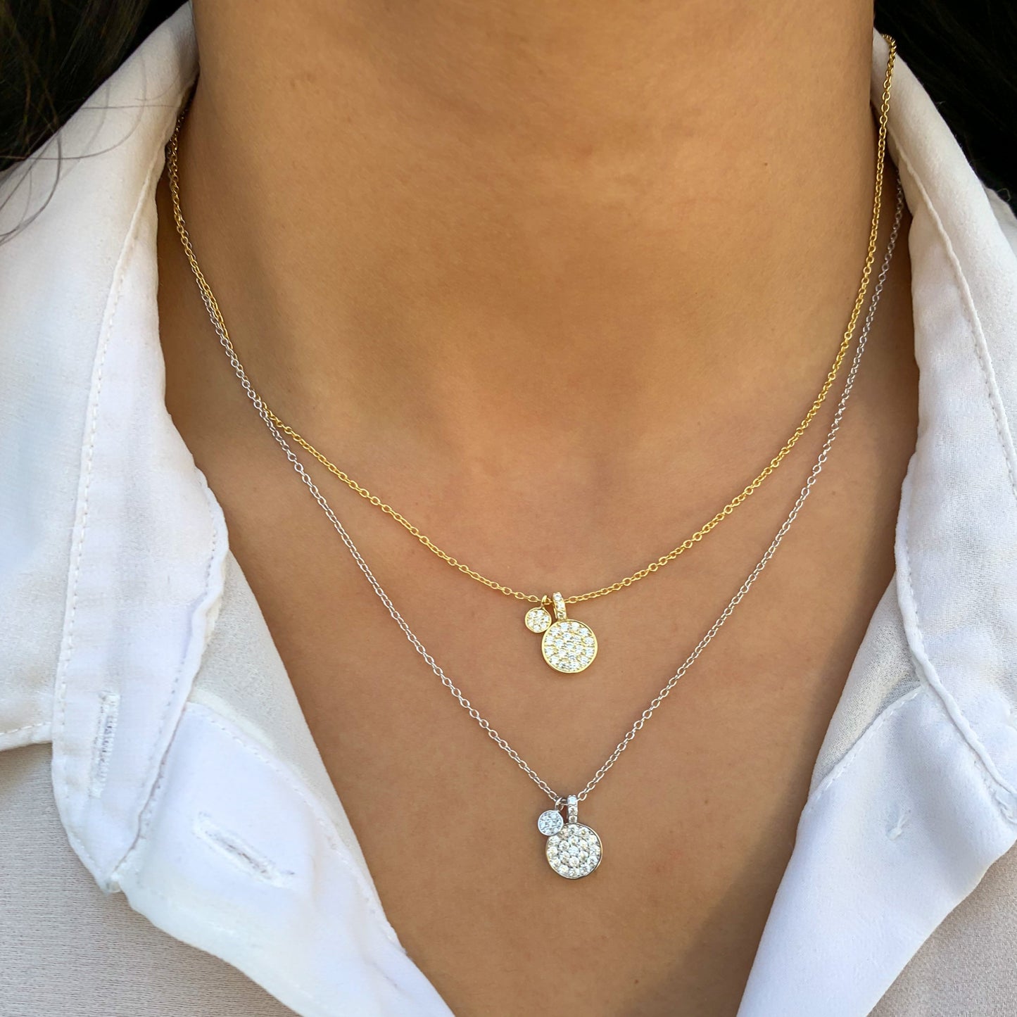 Wearing the gold and disc charm necklaces from Alexandra Marks Jewelry