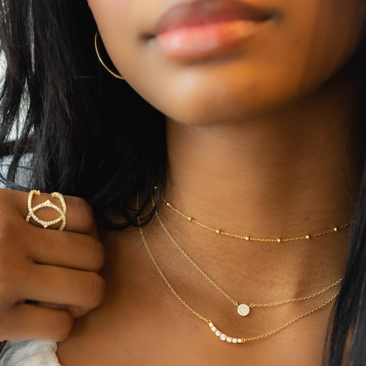Wearing the mini gold disc necklace from Alexandra Marks Jewelry