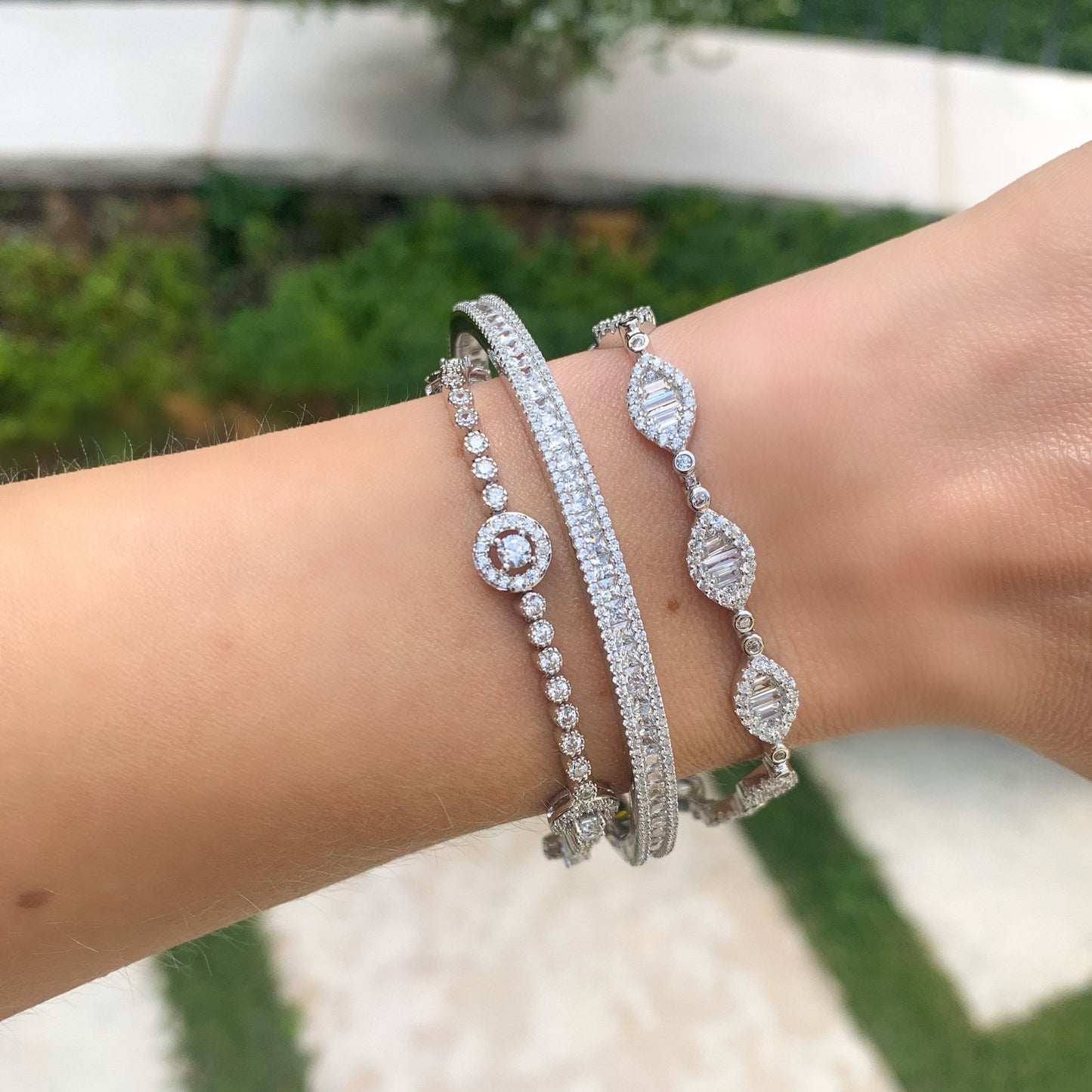 Stacking Alexandra's marquise shaped halo CZ tennis bracelet in silver