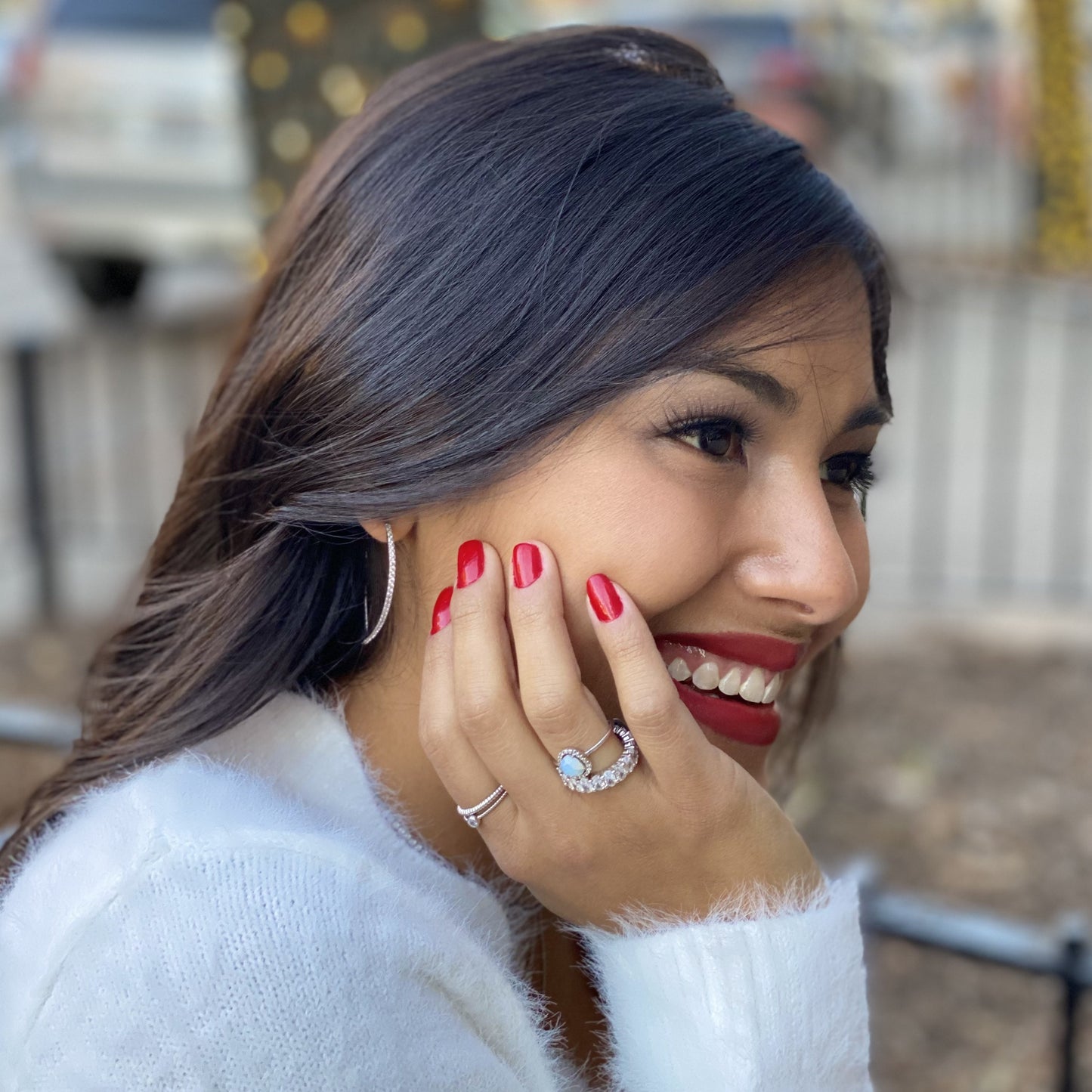 Silver, thin cz hoop earrings on a model