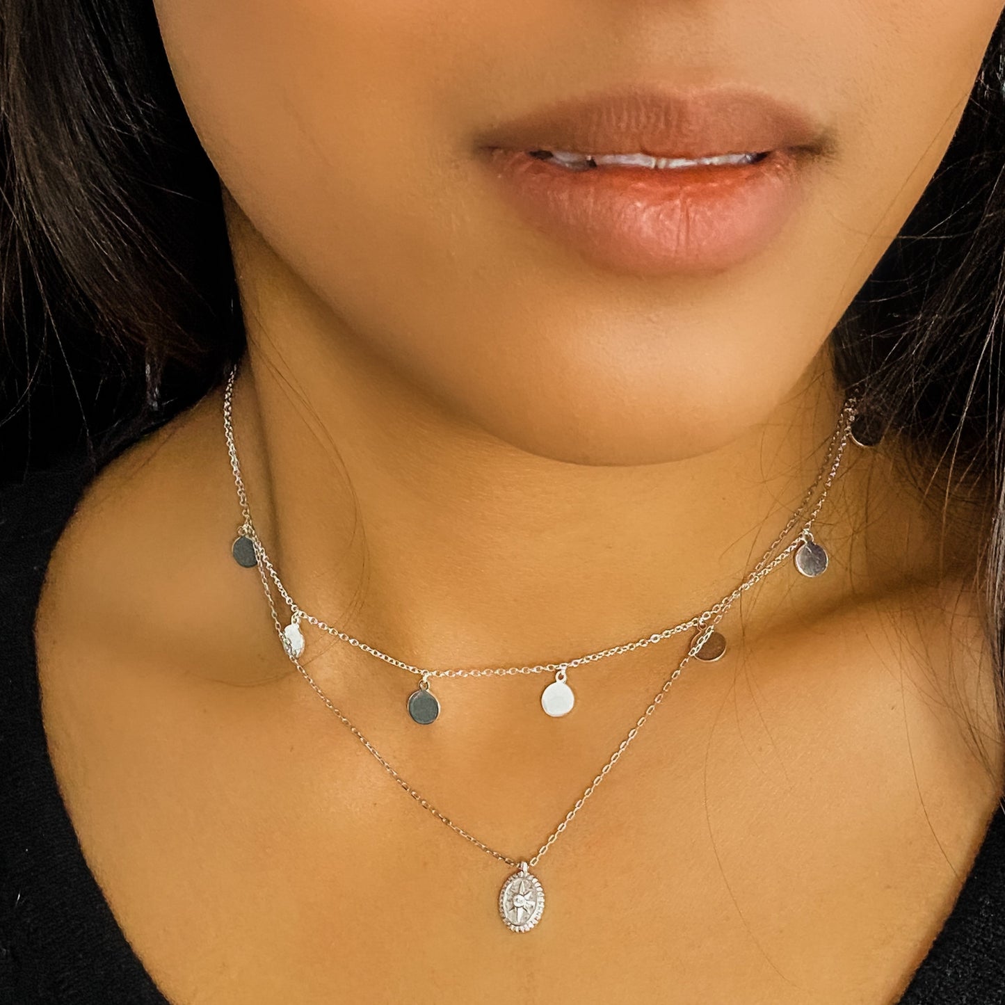 Wearing the silver compass charm necklace from Alexandra Marks Jewelry