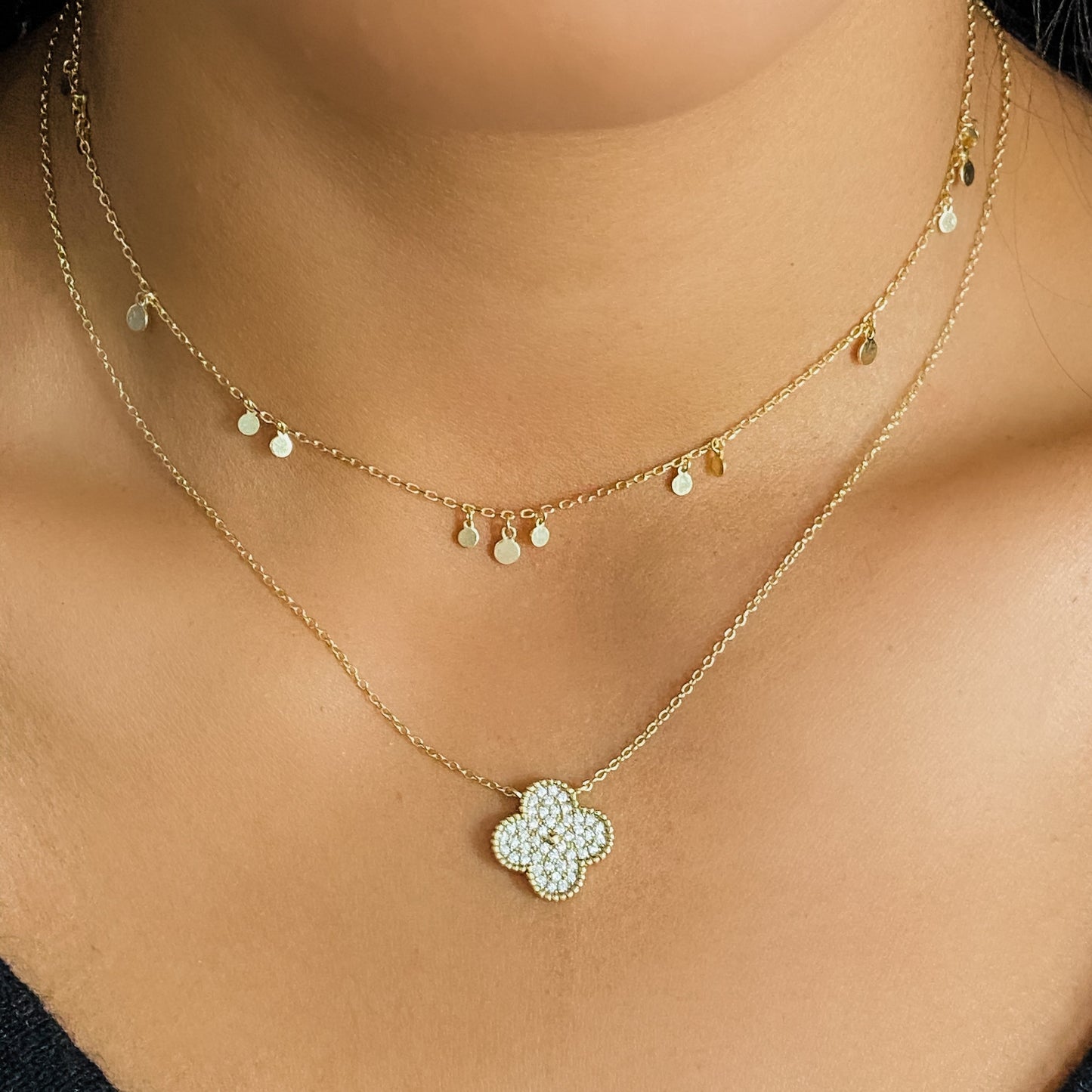 Wearing the gold tiny disc charm choker necklace from Alexandra Marks Jewelry