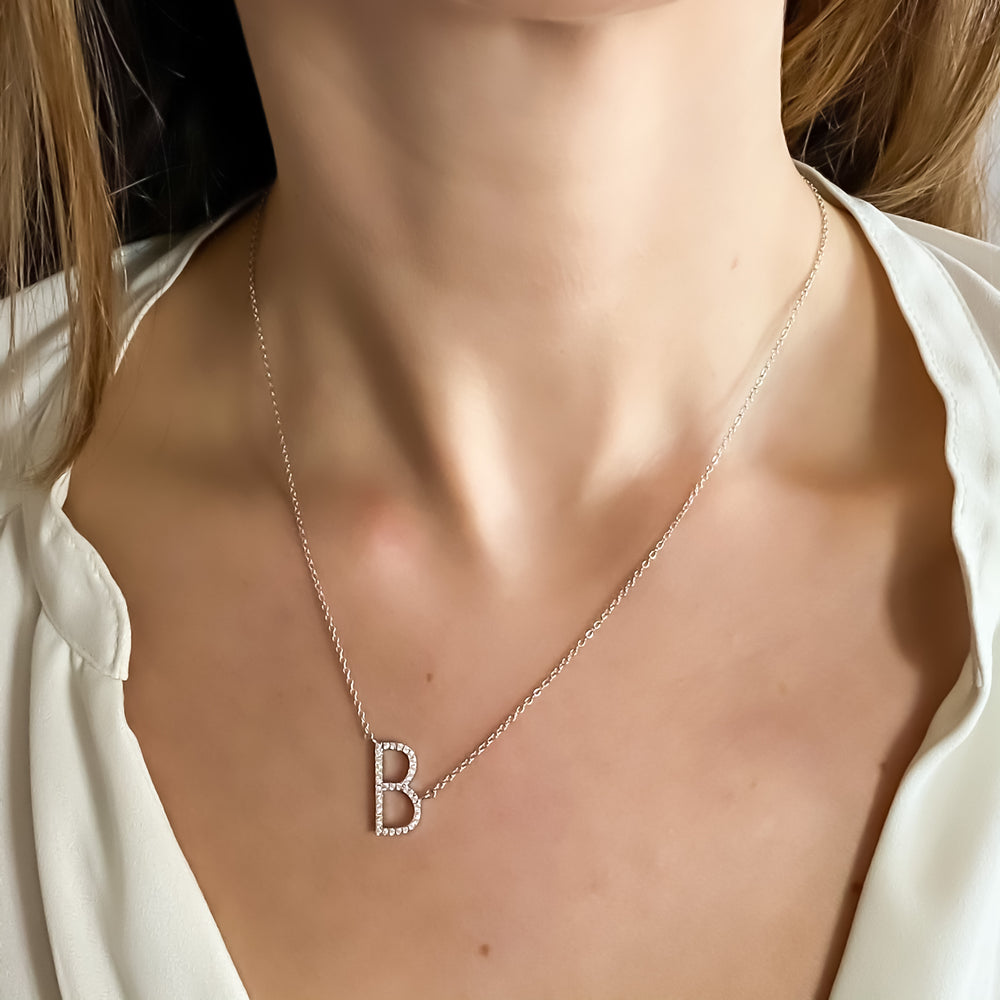Wearing the sterling silver CZ Sideways letter B initial necklace from Alexandra Marks Jewelry