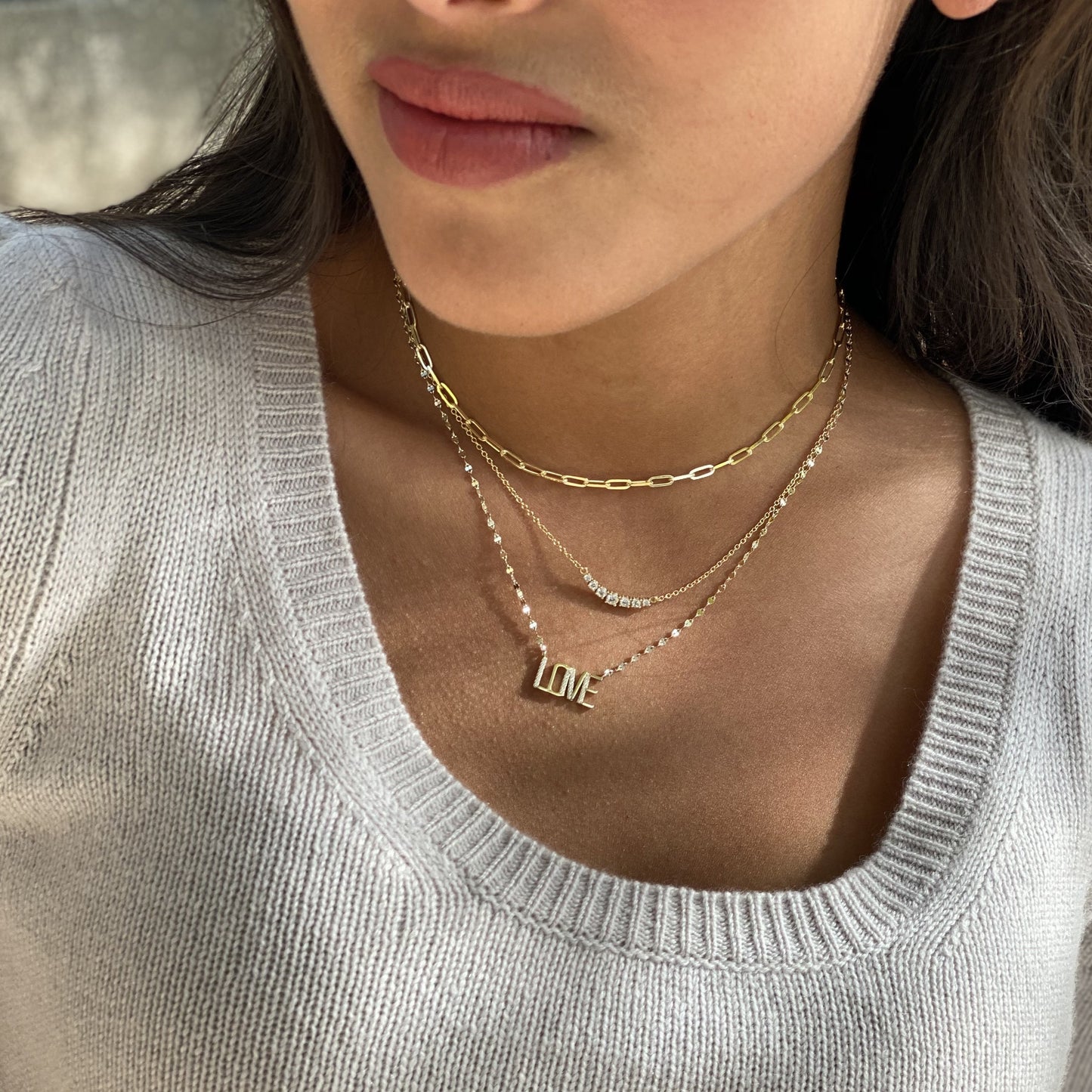 Wearing our capitial letter LOVE necklace in gold - Alexandra Marks Jewelry
