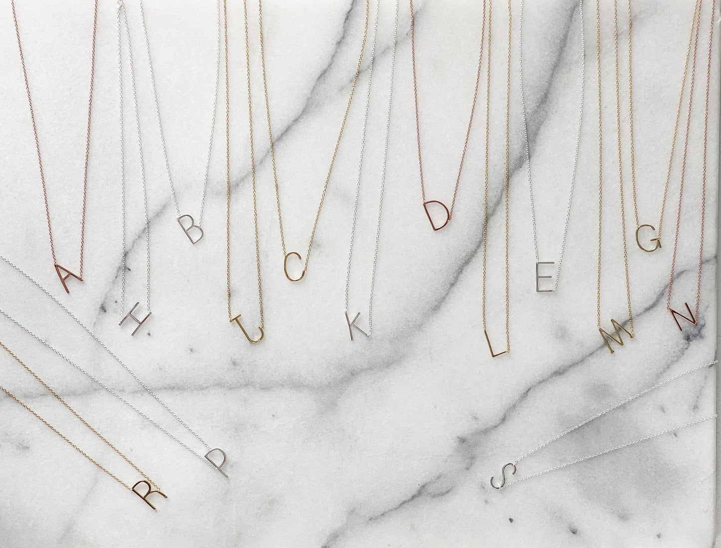 Our best selling plain sideways initial necklaces in rose gold, silver and gold.
