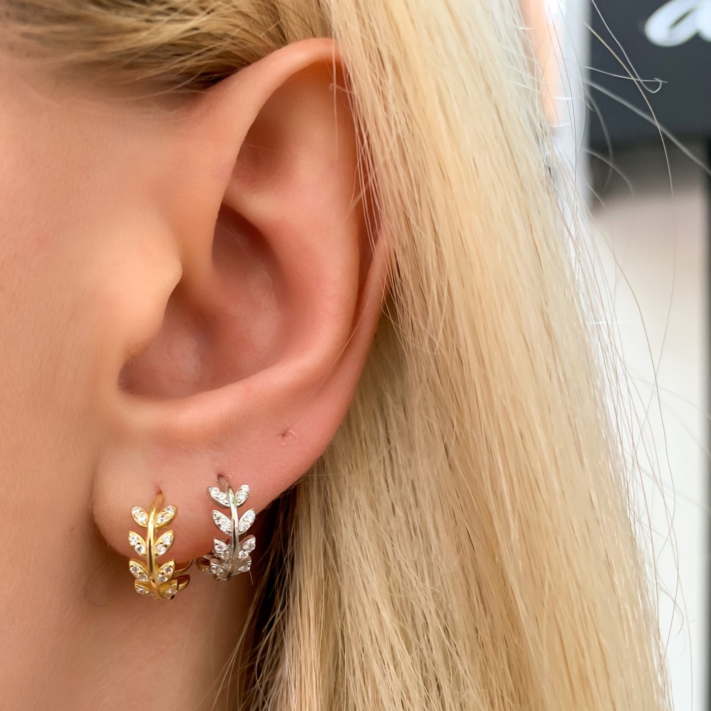 Alexandra Marks wearing the silver and the gold vine huggie hoop earrings