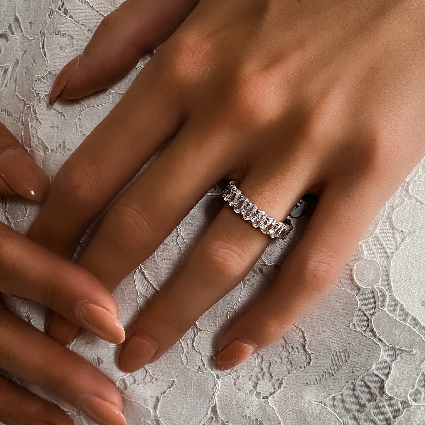 A bride wearing the oval eternity band from Alexandra Marks Jewelry