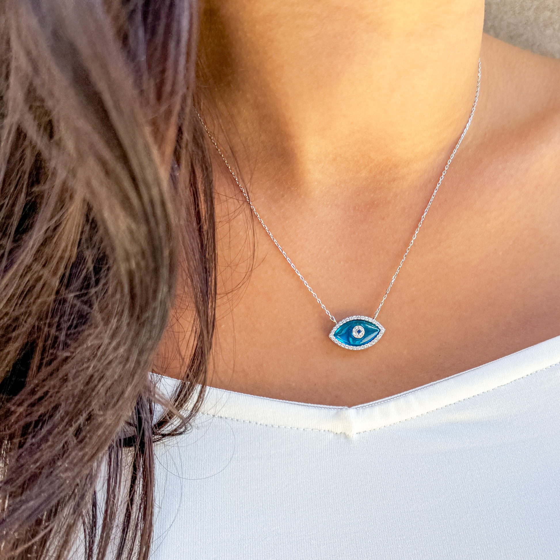 Bright Blue Evil Eye Necklace in silver