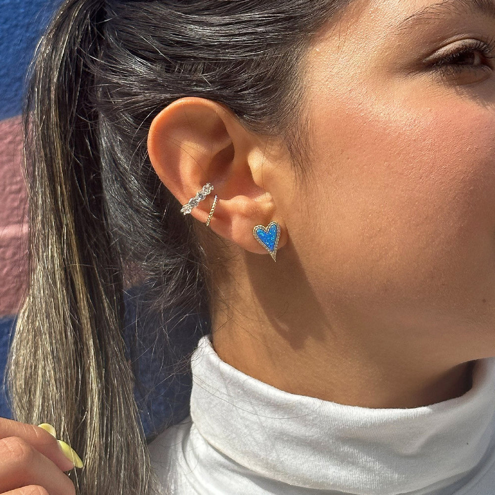 Wearing the large gold and blue opal stud earrings