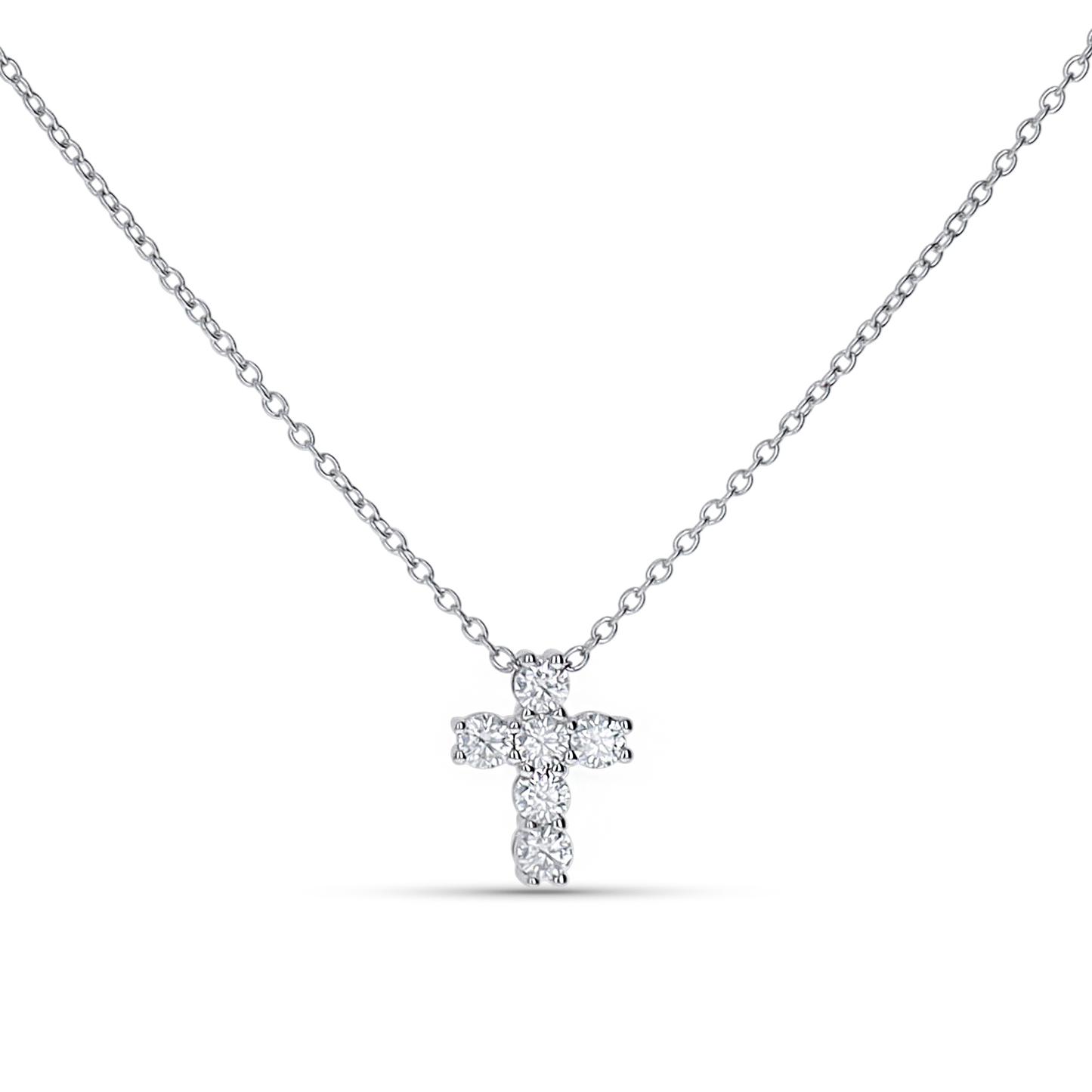 Dainty cross pendant necklace in sterling silver from Alexandra Marks Jewelry. 