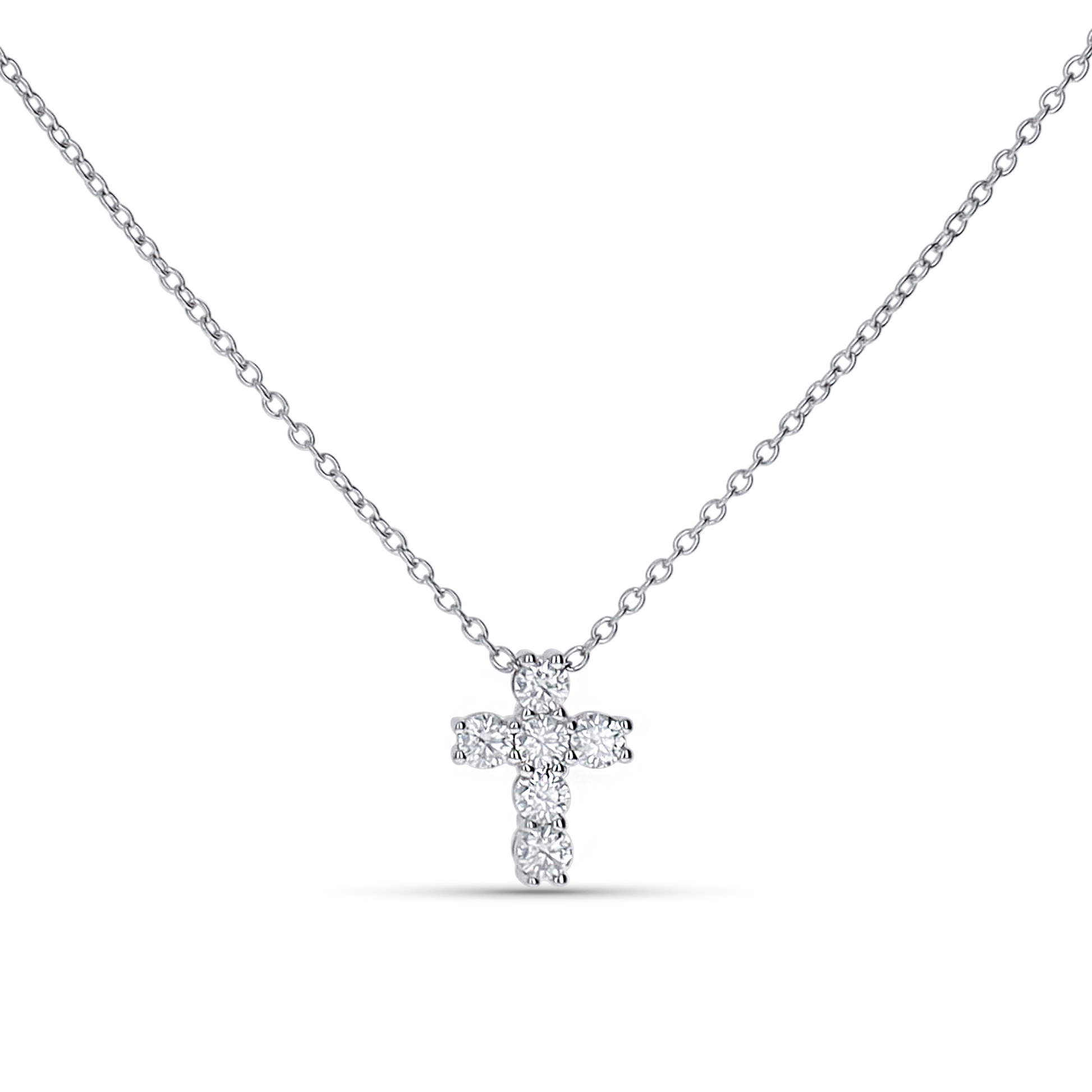 Dainty cross pendant necklace in sterling silver from Alexandra Marks Jewelry. 