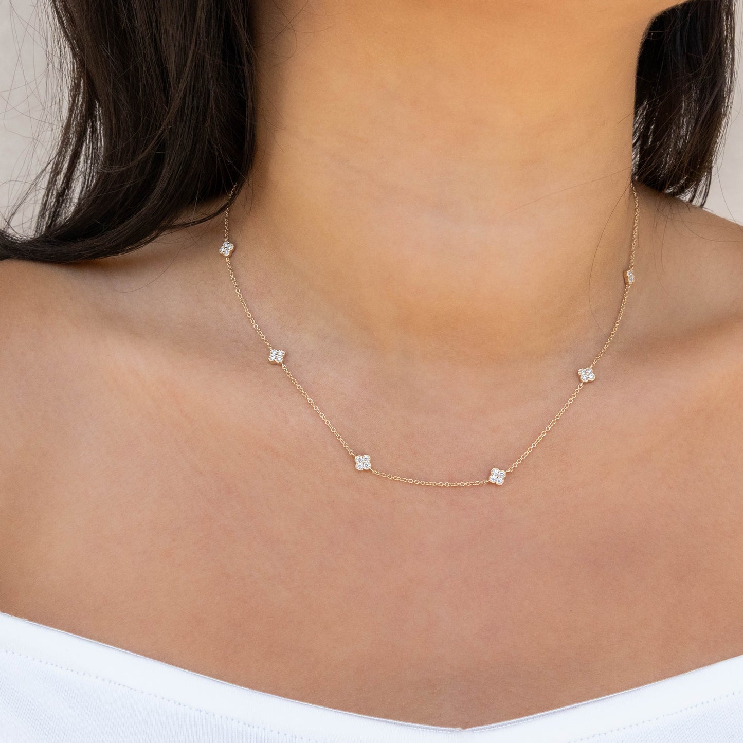 Gold necklace with diamond clover stations from Alexandra Marks Jewelry