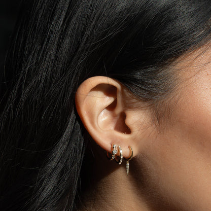 Dramatic diamond drop huggie hoop earrings in 14kt Yellow Gold