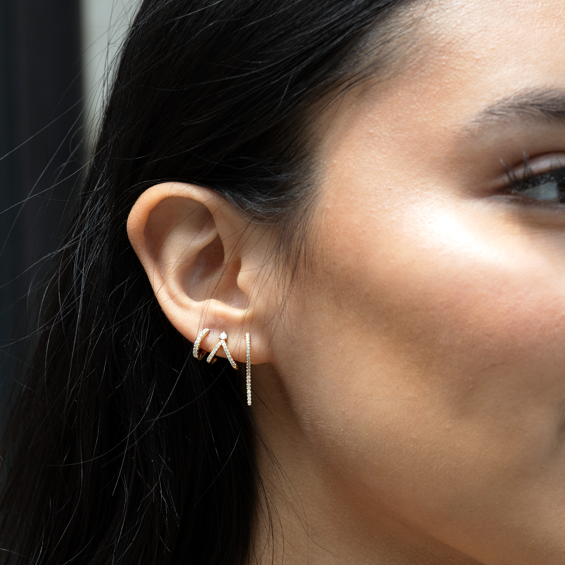 Dainty diamond hoop earrings in 14kt yellow gold. 