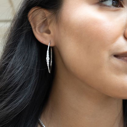 Sterling Silver Cascading CZ Graduated Hoop Earrings.