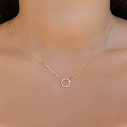 Gold open circle necklace with pave' diamond stones in gold. 