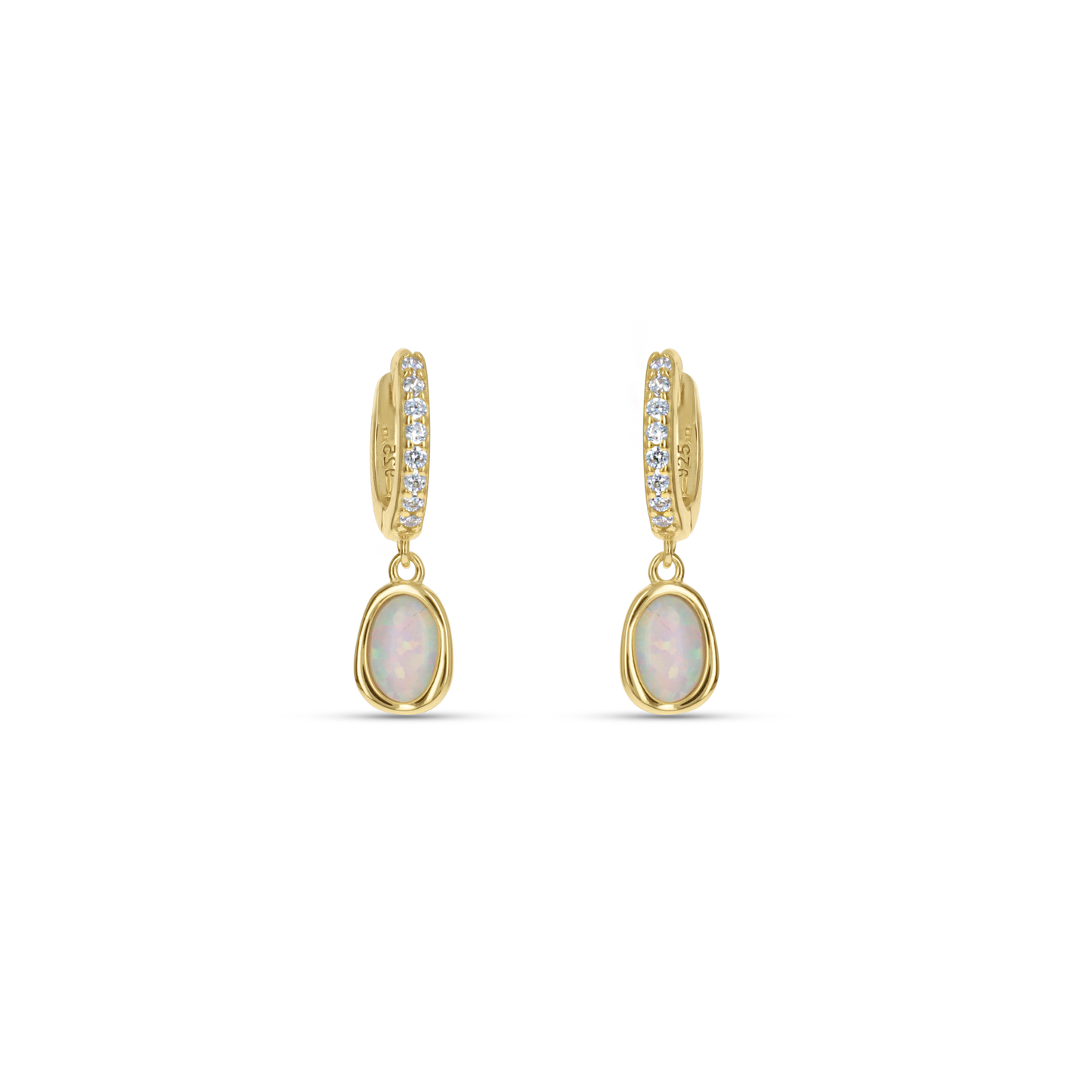 Dainty White Opal Gold Huggie Hoop Earrings from Alexandra Marks Jewelry. 