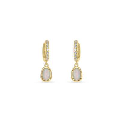 Dainty White Opal Gold Huggie Hoop Earrings from Alexandra Marks Jewelry. 