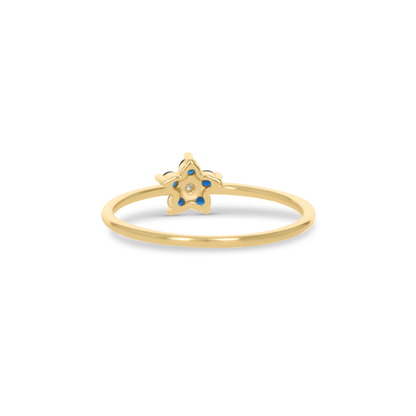 Thin Gold Ring With Blue CZ Flower Design.