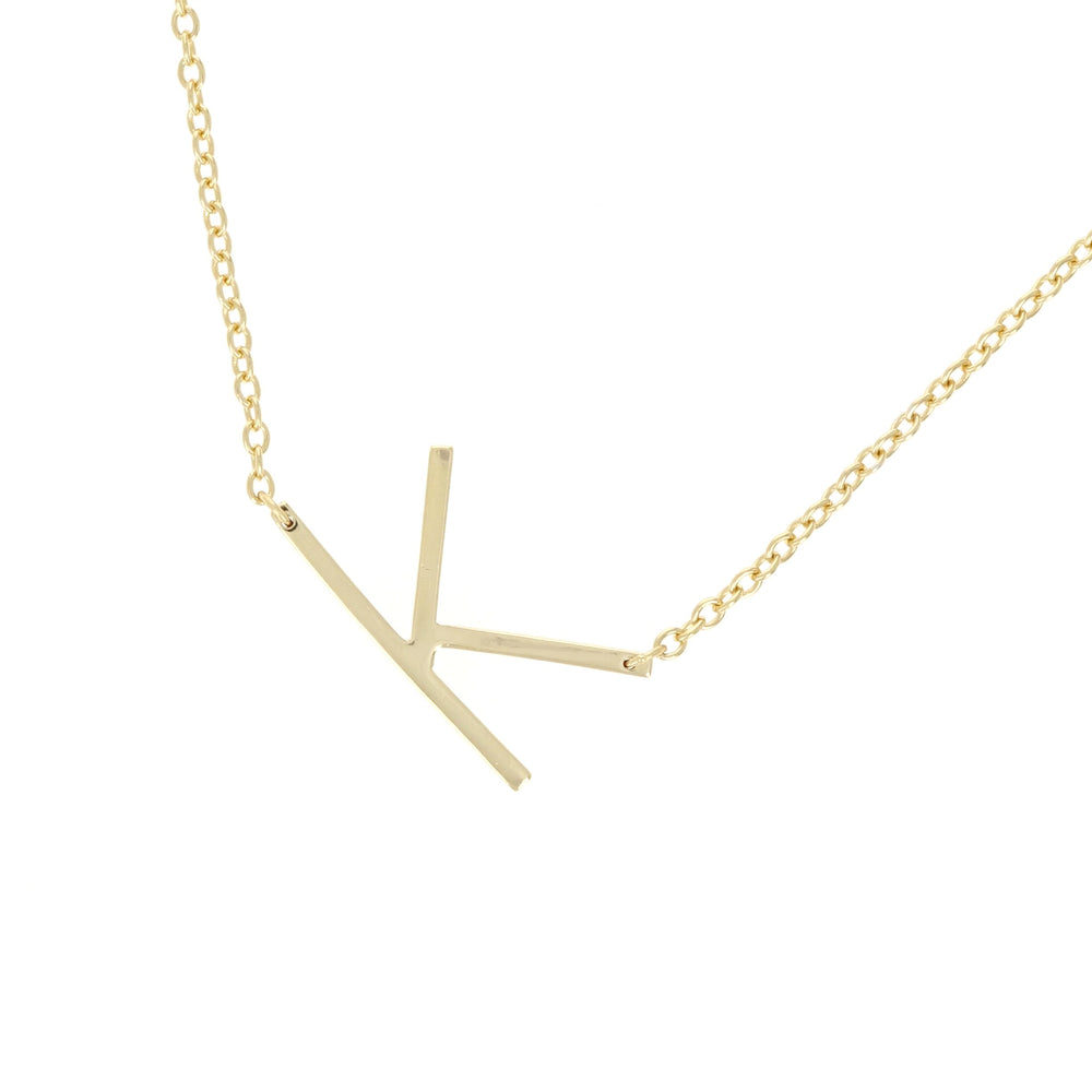 Alexandra Marks - sideways letter k initial necklace in gold