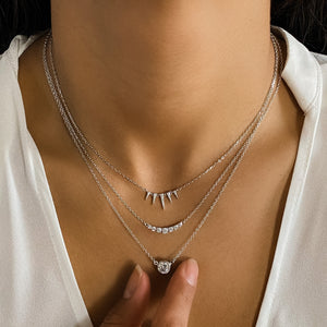Wearing the tiny silver triangle necklace from Alexandra Marks Jewelry
