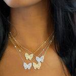 Wearing the gold and silver cz Butterfly Necklaces from Alexandra Marks Jewelry