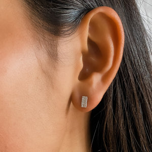 Wearing the 14kt white gold and diamond bar stud earrings from Alexandra Marks Jewelry