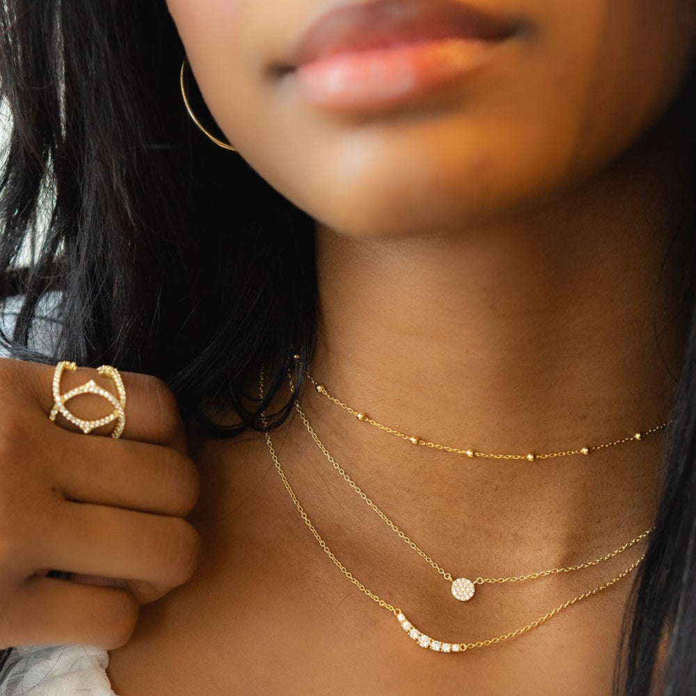 Wearing the mini gold disc necklace from Alexandra Marks Jewelry