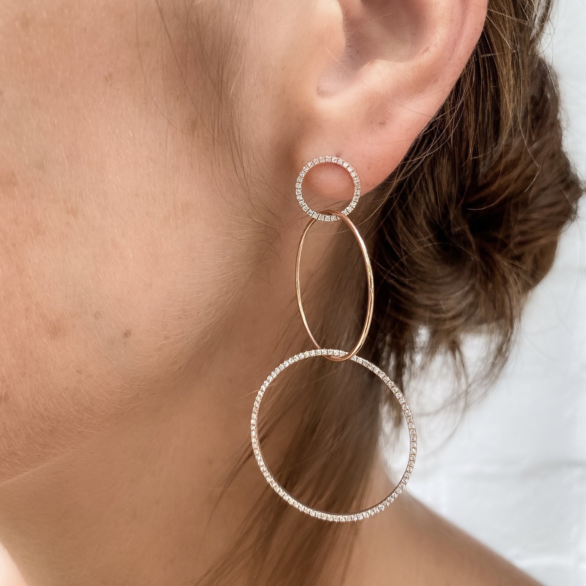 Model wearing Alexandra Marks 14kt rose gold and diamond circle statement earrings