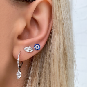 Alexandra Marks wearing the silver cz evil eye stud earrings