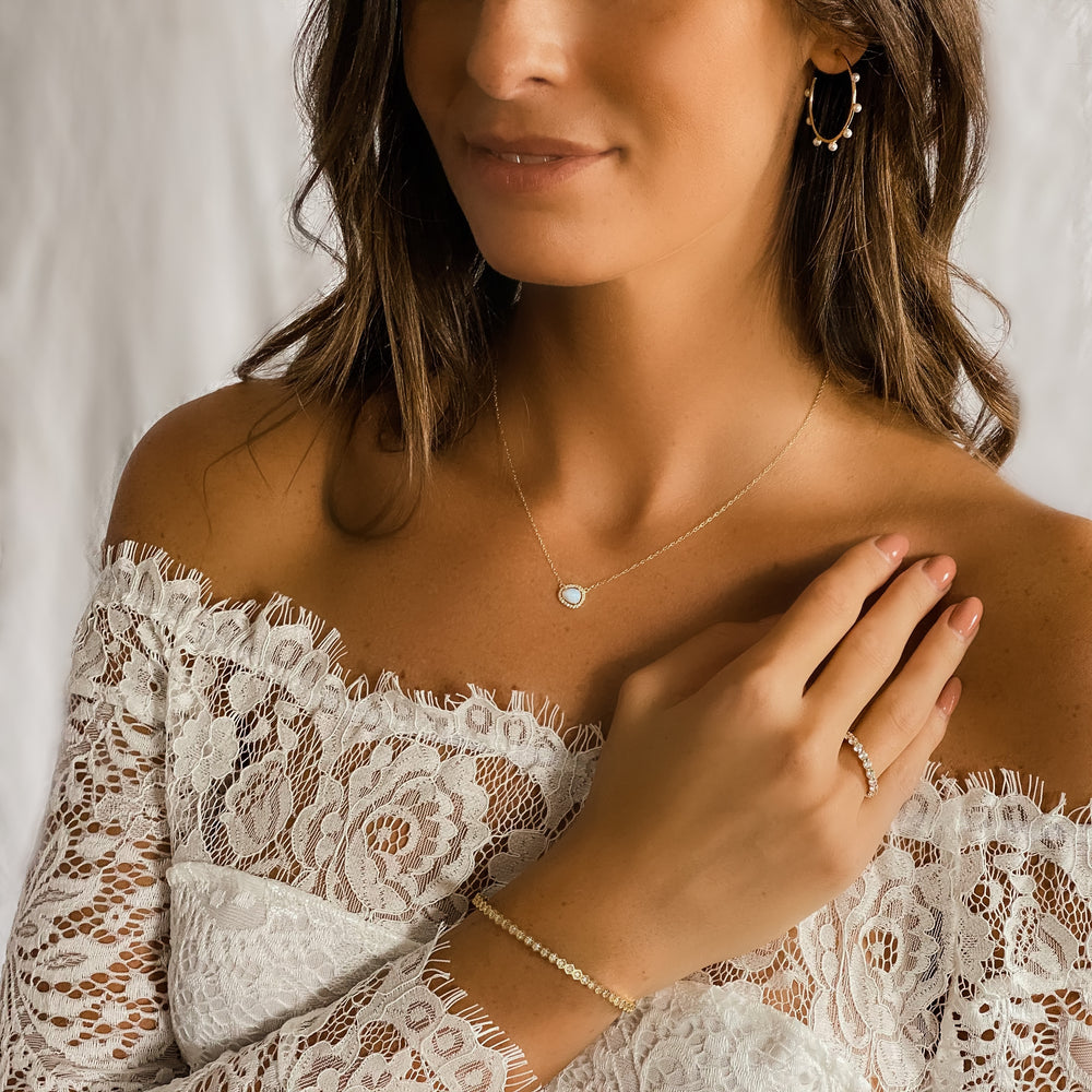A bride wearing the geometric hexagon gold bracelet from Alexandra Marks Jewelry