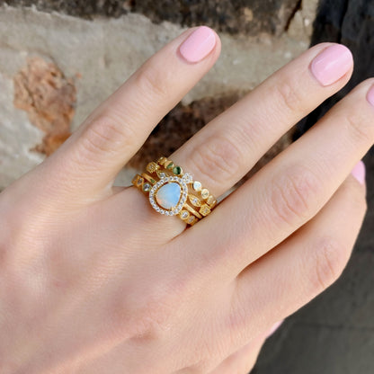 Gold free-form opal ring stacked with our some of our best selling stacking rings in gold