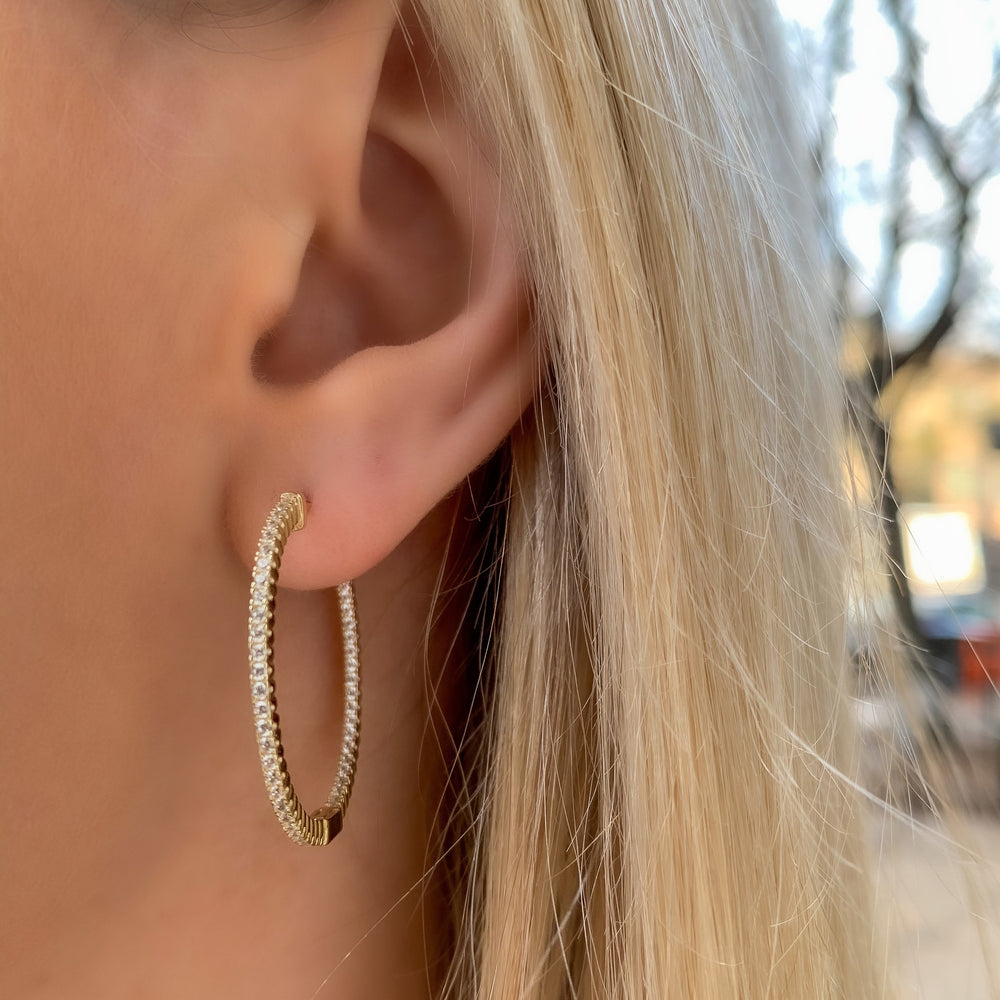 
            
                Load image into Gallery viewer, Alexandra wearing the thin gold inside-outside hoop earrings
            
        