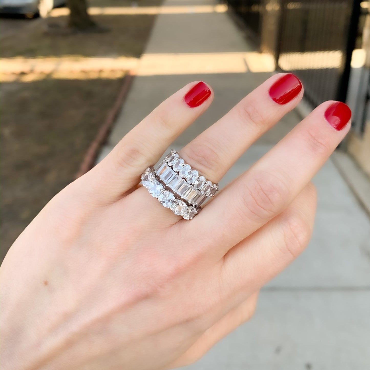 Alexandra Marks stacking her Oval, Emerald and Cushion Cut CZ Eternity bands