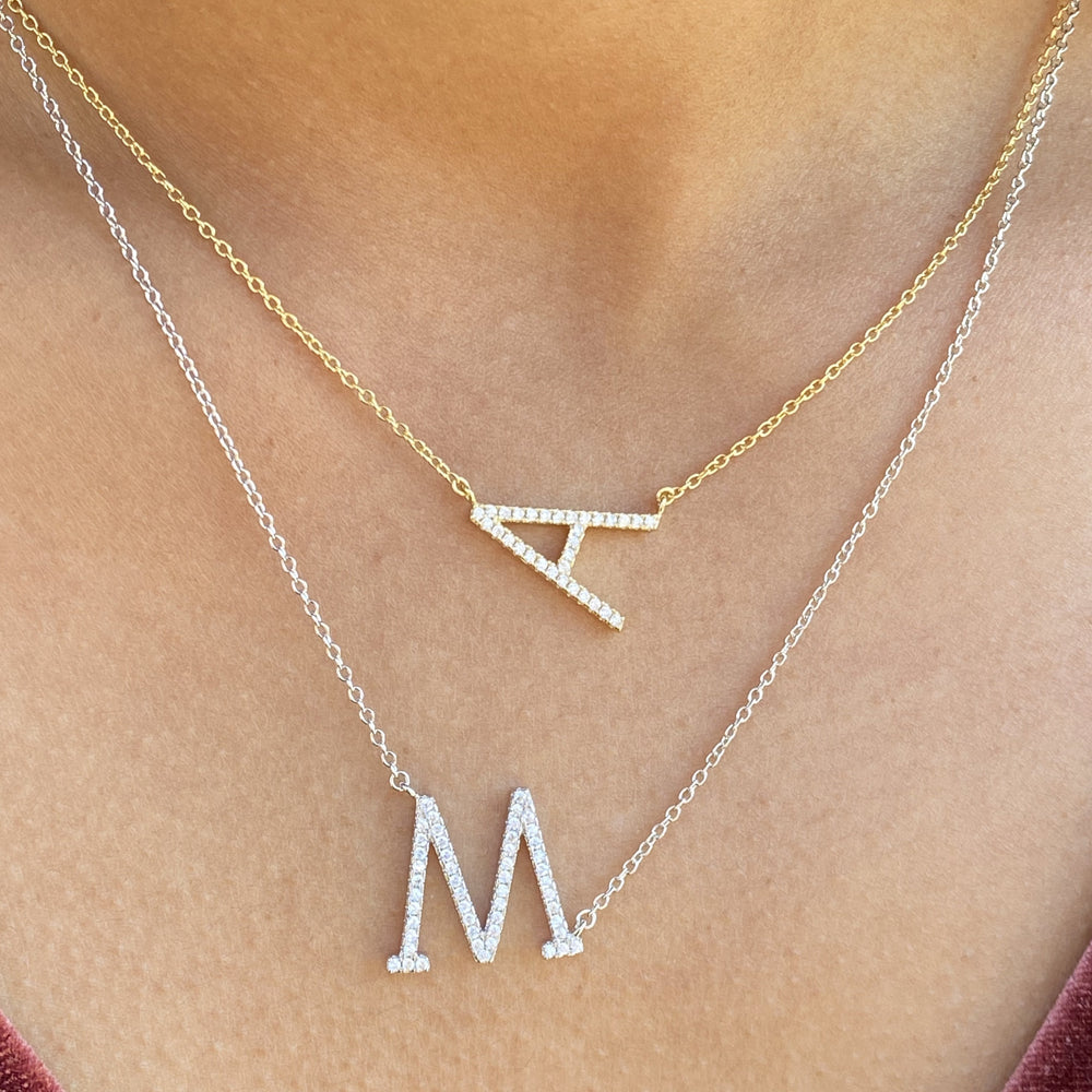 Wearing our gold & silver cz initial necklaces at Alexandra Marks Jewelry