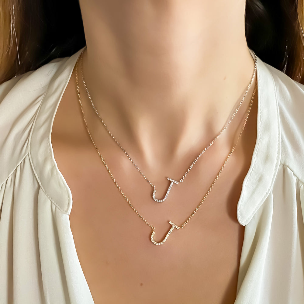 Wearing the gold and silver sideways initial necklaces from Alexandra Marks Jewelry
