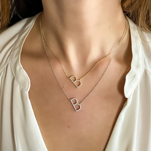 
            
                Load image into Gallery viewer, Wearing the gold and silver CZ Letter B Initial necklaces from Alexandra Marks Jewelry
            
        