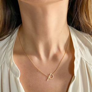 
            
                Load image into Gallery viewer, Wearing the gold sideways letter P initial necklace - Alexandra Marks Jewelry
            
        