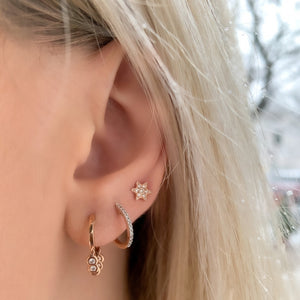 
            
                Load image into Gallery viewer, Alexandra Marks wearing the petite star stud earring in her third earring hole
            
        