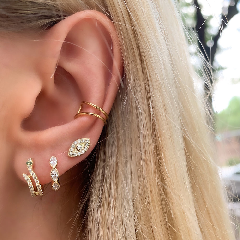
            
                Load image into Gallery viewer, Wearing our pave&amp;#39; cz gold evil eye stud earrings
            
        