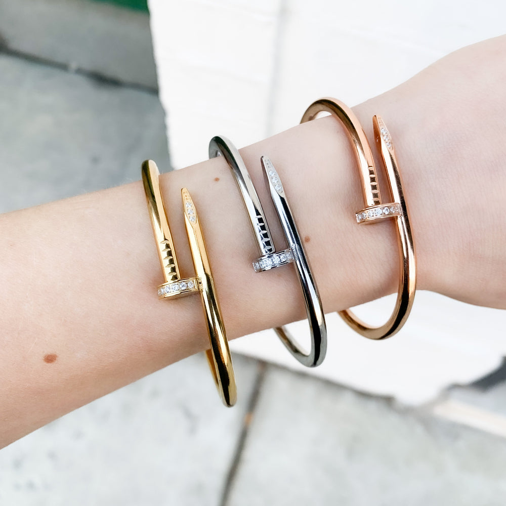 Stacking the gold, rose and silver nail bangle bracelets