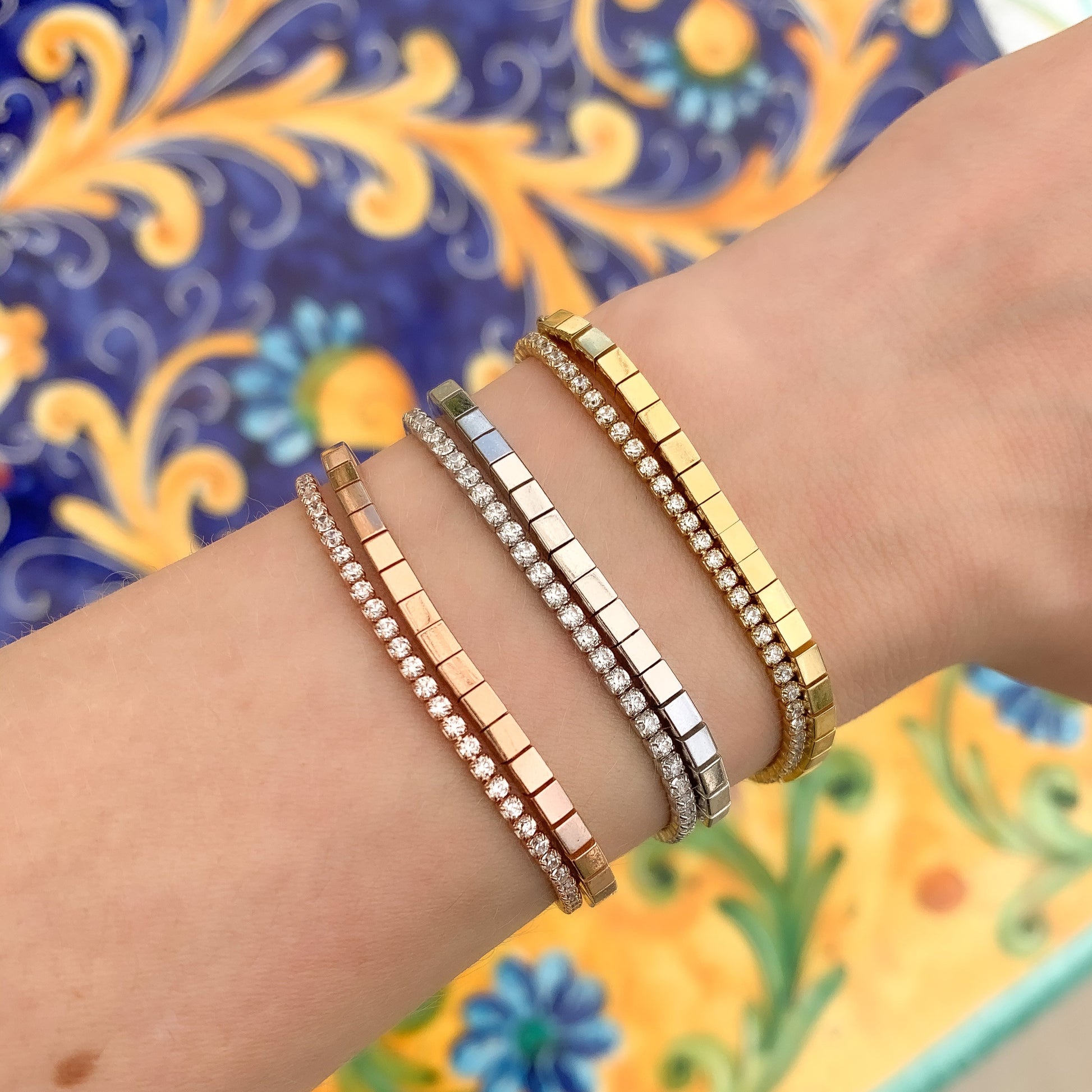 Creating a modern bracelet stack with our thin cz tennis bracelets at Alexandra Marks Jewelry