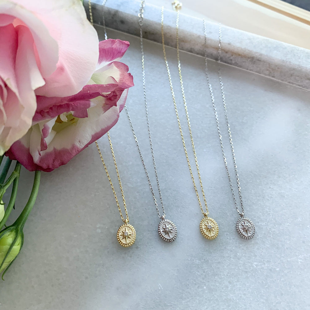 Tiny gold and silver compass charm necklaces 