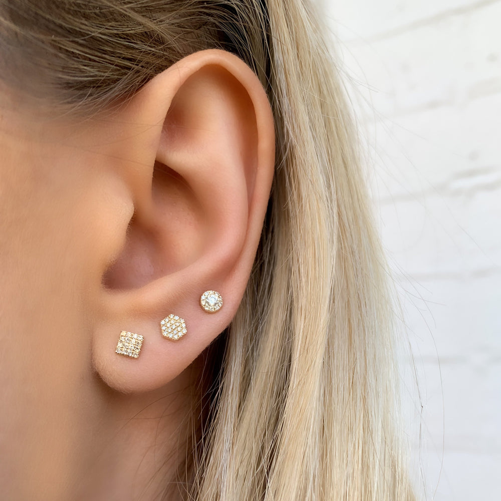 Alexandra Marks wearing an diamond earring stack with the diamond hexagon stud earrings