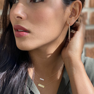Wearing our petite double row diamond bar necklace in 14kt gold - Alexandra Marks Jewelry