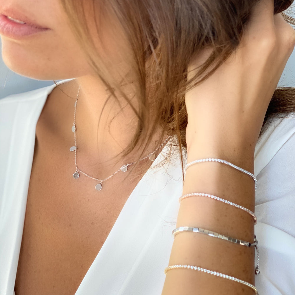 Stacking the rose gold, gold and silver thin cz tennis bracelets from Alexandra Marks Jewelry